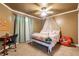 Bright bedroom featuring a ceiling fan, a cozy chair, and a comfortable bed at 3127 W Sligh Ave # 303B, Tampa, FL 33614