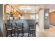 Open kitchen with breakfast bar, pendant lighting, and tile flooring at 3127 W Sligh Ave # 303B, Tampa, FL 33614
