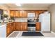 Traditional kitchen with stainless steel appliances and ample cabinet space at 3127 W Sligh Ave # 303B, Tampa, FL 33614