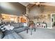 Spacious living room with spiral staircase, vaulted ceilings, and carpet flooring at 3127 W Sligh Ave # 303B, Tampa, FL 33614