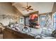 Cozy living room featuring a fireplace, television, large sectional sofa, and Christmas decorations at 3127 W Sligh Ave # 303B, Tampa, FL 33614