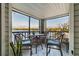 Relaxing screened patio with comfortable seating offers beautiful lake views at 3127 W Sligh Ave # 303B, Tampa, FL 33614
