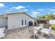 Cozy backyard brick patio with outdoor brick fireplace, a perfect retreat for entertaining at 3301 Tuckahoe Pl, Holiday, FL 34690