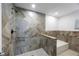 Beautiful bathroom featuring a shower with stylish brown tile accents and step at 3301 Tuckahoe Pl, Holiday, FL 34690