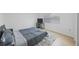 Cozy bedroom with a bed, rug and tv at 3301 Tuckahoe Pl, Holiday, FL 34690