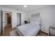 Bedroom with white furniture, a desk, closet, and light-filled window at 3301 Tuckahoe Pl, Holiday, FL 34690