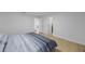 Bright bedroom featuring wood floors and white walls at 3301 Tuckahoe Pl, Holiday, FL 34690