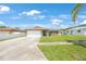 Inviting single-Gathering home boasting a manicured lawn, stone accents, and a convenient two-car garage, perfect for suburban living at 3301 Tuckahoe Pl, Holiday, FL 34690