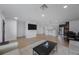 Modern living area with sleek hardwood floors, contemporary decor, and an open layout, perfect for entertaining guests and everyday living at 3301 Tuckahoe Pl, Holiday, FL 34690