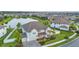 Beautiful home with a three-car garage and manicured landscaping situated in a serene lakeside community at 33075 Kateland Dr, Wesley Chapel, FL 33545
