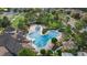 This Primary planned community features a large swimming pool with plenty of space to sit and relax under mature shade trees at 33075 Kateland Dr, Wesley Chapel, FL 33545
