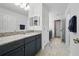 Bathroom with dual vanities, granite countertops and modern fixtures at 33075 Kateland Dr, Wesley Chapel, FL 33545