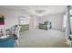 Bedroom with carpet, soft pastel walls, and comfortable furnishings at 33075 Kateland Dr, Wesley Chapel, FL 33545