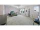Large bedroom with carpet, ample space, and a charming chandelier at 33075 Kateland Dr, Wesley Chapel, FL 33545