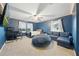 Cozy bedroom with a large beanbag, a workspace, carpet, and a ceiling fan at 33075 Kateland Dr, Wesley Chapel, FL 33545