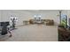 Spacious bonus room with carpet, a workstation, sectional, and natural light from multiple windows at 33075 Kateland Dr, Wesley Chapel, FL 33545