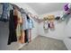 Walk-in closet with ample shelving and hanging space for organized storage at 33075 Kateland Dr, Wesley Chapel, FL 33545