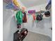 Organized closet featuring shelving and hanging rods for clothing and accessories at 33075 Kateland Dr, Wesley Chapel, FL 33545