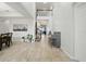 Bright foyer features soaring ceilings, neutral tile floors, and an open staircase at 33075 Kateland Dr, Wesley Chapel, FL 33545