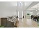Bright foyer with high ceilings, chandelier, a piano, and a dining table and chairs at 33075 Kateland Dr, Wesley Chapel, FL 33545