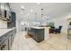Modern kitchen showcasing gray cabinets, white countertops, and stainless steel appliances at 33075 Kateland Dr, Wesley Chapel, FL 33545