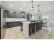 Spacious kitchen featuring gray cabinets, stainless steel appliances, and a large center island at 33075 Kateland Dr, Wesley Chapel, FL 33545