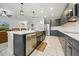 Modern kitchen showcasing a stainless steel sink, dark cabinets, and stainless appliances at 33075 Kateland Dr, Wesley Chapel, FL 33545