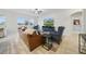 Open living room featuring tile flooring, a ceiling fan, and sliding glass doors to the patio at 33075 Kateland Dr, Wesley Chapel, FL 33545