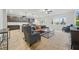 Open concept living room featuring a modern ceiling fan and views of the backyard at 33075 Kateland Dr, Wesley Chapel, FL 33545
