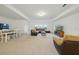 Open floorplan with living and dining space, carpet, and many windows for natural light at 33075 Kateland Dr, Wesley Chapel, FL 33545