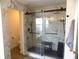 Bathroom featuring modern shower with rainfall showerhead and marble-tiled walls at 3512 Osprey Cove Dr, Riverview, FL 33578