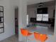 Kitchen with stone countertops and backsplash, stainless steel appliances and ample lighting at 3512 Osprey Cove Dr, Riverview, FL 33578