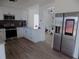 Modern kitchen with white cabinetry, stainless steel appliances, and stylish backsplash, creating a sleek and functional space at 3512 Osprey Cove Dr, Riverview, FL 33578
