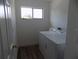 Functional laundry room with a washer and dryer, natural light, and ample space for laundry tasks at 3512 Osprey Cove Dr, Riverview, FL 33578