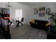 Bright living space with modern decor, hardwood floors, and a view of the open dining area at 3512 Osprey Cove Dr, Riverview, FL 33578