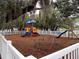 Community playground with slides, climbing dome, and other play structures on a mulch surface at 3512 Osprey Cove Dr, Riverview, FL 33578