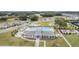 A community featuring lush green spaces, well-maintained homes, a pool, and other amenities for relaxed living at 36414 Well Hill Way, Zephyrhills, FL 33541