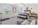 Bedroom with a bed, chair, and two windows at 36414 Well Hill Way, Zephyrhills, FL 33541