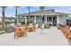 Outdoor community clubhouse area with stainless grills, seating, lounge chairs and covered porch at 36414 Well Hill Way, Zephyrhills, FL 33541