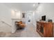 Upstairs hallway with a seating area and dark wood cabinet at 36414 Well Hill Way, Zephyrhills, FL 33541