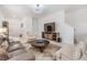 Bright and airy living room featuring neutral tones and a stylish seating arrangement at 36414 Well Hill Way, Zephyrhills, FL 33541
