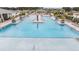 Spacious community pool with ample seating, offering a relaxing and inviting atmosphere for residents at 36414 Well Hill Way, Zephyrhills, FL 33541