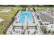 A sprawling community pool with lounge chairs and dining, offering relaxation and socialization at 36414 Well Hill Way, Zephyrhills, FL 33541