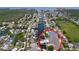 Waterfront property with boat lift and dock, surrounded by lush landscaping and canal access at 386 Westwinds Dr, Palm Harbor, FL 34683