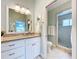 Nicely appointed bathroom with granite countertops, tiled shower, and a toilet at 386 Westwinds Dr, Palm Harbor, FL 34683