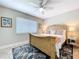 Comfortable bedroom featuring a unique bed frame, coastal decor, and bedside lamps at 386 Westwinds Dr, Palm Harbor, FL 34683