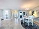 Open dining area featuring tiled floors, chandelier, and a view into another room at 386 Westwinds Dr, Palm Harbor, FL 34683
