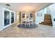 Open dining area with easy access to stairs, featuring tiled floors and a chandelier at 386 Westwinds Dr, Palm Harbor, FL 34683