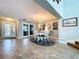 Inviting dining area with elegant chandelier, white table, and tile floors at 386 Westwinds Dr, Palm Harbor, FL 34683