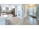 Bright entryway view of modern kitchen with stainless steel appliances and stylish finishes at 386 Westwinds Dr, Palm Harbor, FL 34683